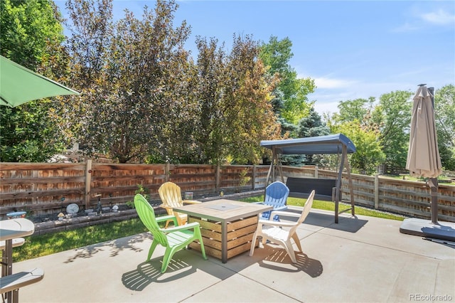 9904 Quintero St, Commerce City, CO 80022 - fenced backyard featuring a patio and outdoor dining space