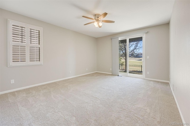 unfurnished room with carpet, baseboards, and ceiling fan