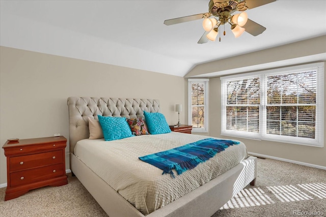 carpeted bedroom featuring ceiling fan and vaulted ceiling