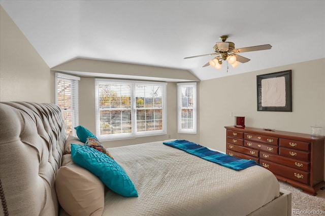 bedroom featuring lofted ceiling, ceiling fan, and carpet floors