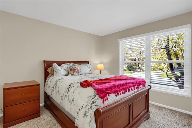 bedroom featuring light carpet