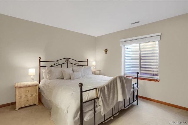 bedroom with light colored carpet