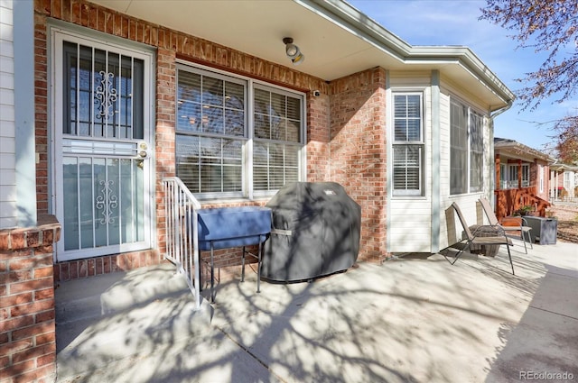 view of patio featuring a grill