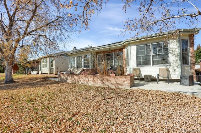 back of property featuring a patio area