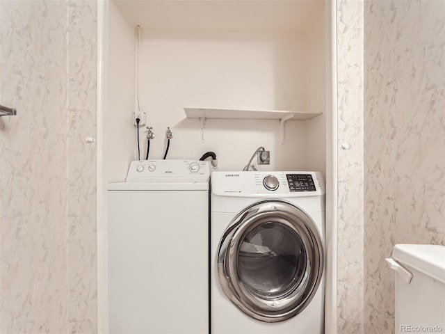 laundry area with washing machine and clothes dryer