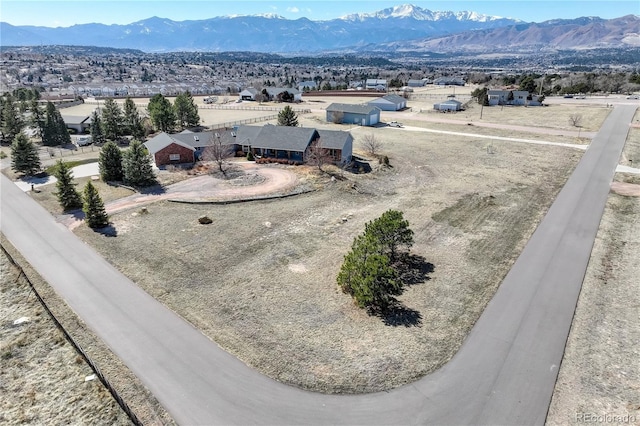 birds eye view of property featuring a mountain view