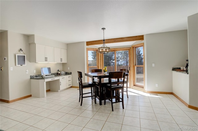 dining room featuring beam ceiling, a notable chandelier, light tile patterned flooring, and baseboards