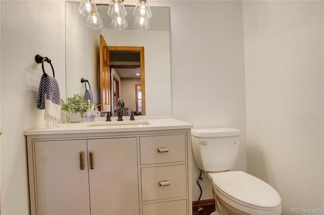 half bath with vanity and toilet