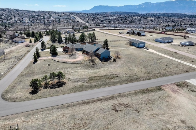 drone / aerial view featuring a mountain view