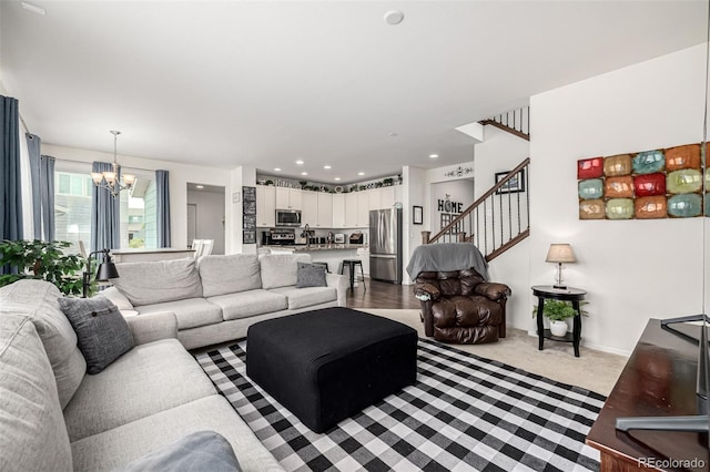9350 Dunraven St, Arvada, CO 80007 - living area with a chandelier, stairs, carpet, and baseboards