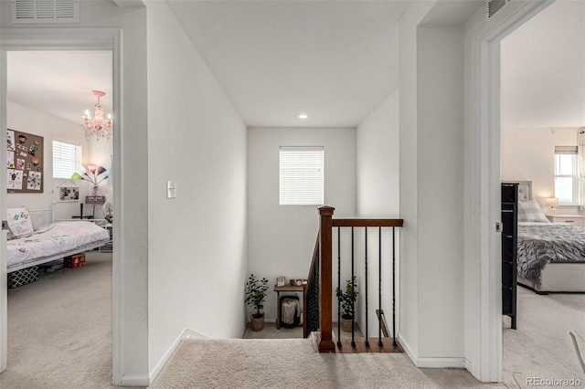 9350 Dunraven St, Arvada, CO 80007 - hall with carpet floors, a chandelier, recessed lighting, and baseboards