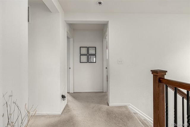 9350 Dunraven St, Arvada, CO 80007 - corridor with carpet floors, an upstairs landing, and baseboards