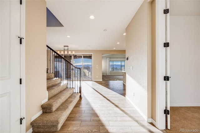 interior space featuring hardwood / wood-style floors and a chandelier