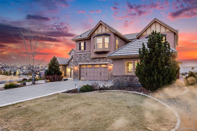 view of front of house with a lawn and a garage