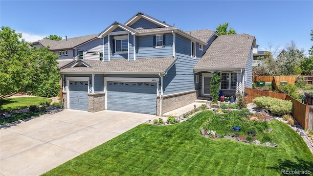 4826 S Ireland St, Aurora, CO 80015 - view of front of home featuring driveway, brick siding, a garage, and roof with shingles