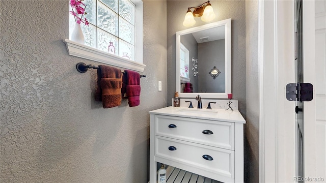 4826 S Ireland St, Aurora, CO 80015 - bathroom featuring vanity and a textured wall