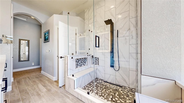 4826 S Ireland St, Aurora, CO 80015 - full bath featuring a stall shower, vanity, baseboards, and wood finished floors
