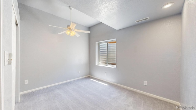 4826 S Ireland St, Aurora, CO 80015 - carpeted spare room with ceiling fan, baseboards, vaulted ceiling, and a textured ceiling