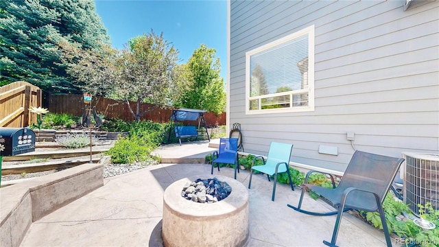 4826 S Ireland St, Aurora, CO 80015 - fenced backyard with a patio, cooling unit, and an outdoor fire pit