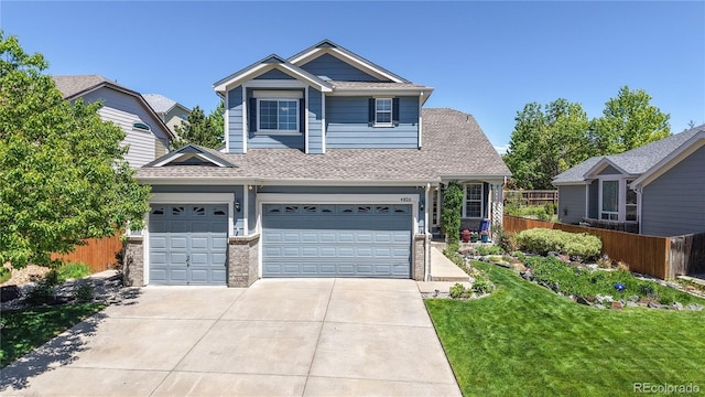4826 S Ireland St, Aurora, CO 80015 - view of front of house with a shingled roof, driveway, and an attached garage