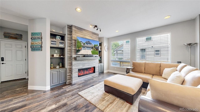 4826 S Ireland St, Aurora, CO 80015 - living room with dark wood-type flooring, baseboards, a fireplace, and recessed lighting