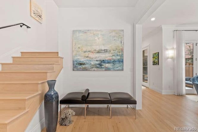 interior space featuring recessed lighting, baseboards, and wood finished floors