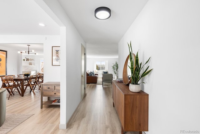 hallway with light wood-style floors