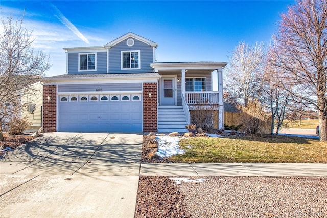 view of front property with a porch, a garage, and a front lawn