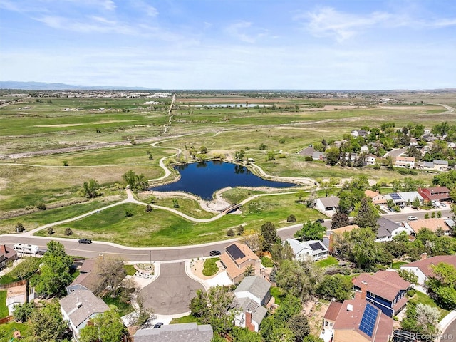 aerial view of residential area with a nearby body of water