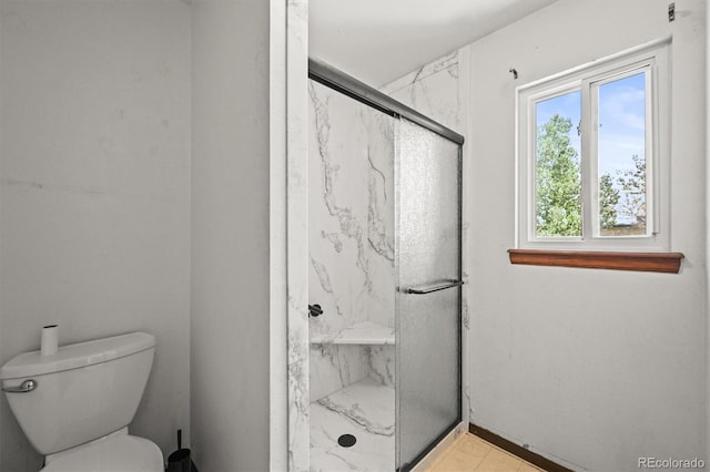 full bathroom featuring a marble finish shower and toilet
