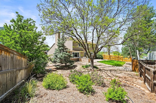 fenced backyard featuring a patio