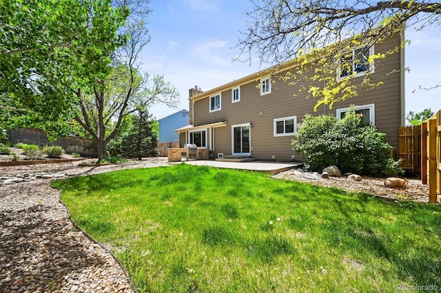 back of property featuring a patio area and a chimney