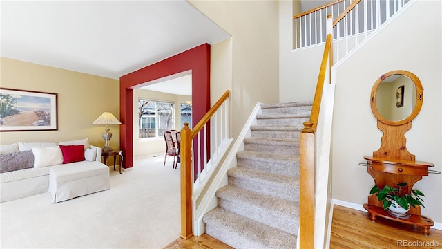 staircase featuring baseboards