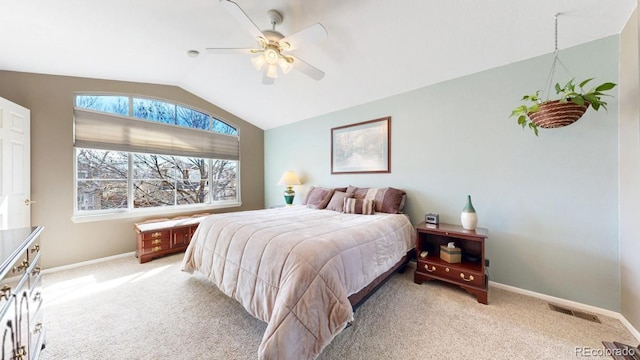 bedroom with light carpet, visible vents, baseboards, a ceiling fan, and lofted ceiling