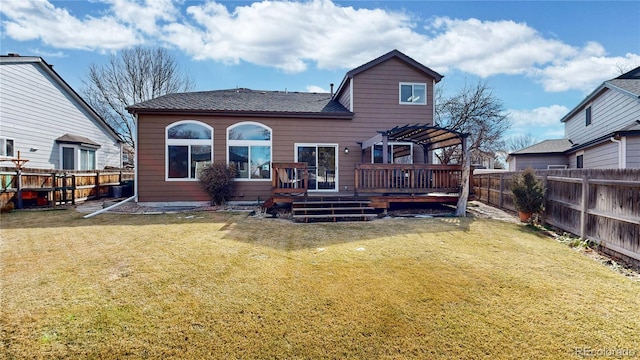 rear view of property with a fenced backyard, a lawn, a deck, and a pergola