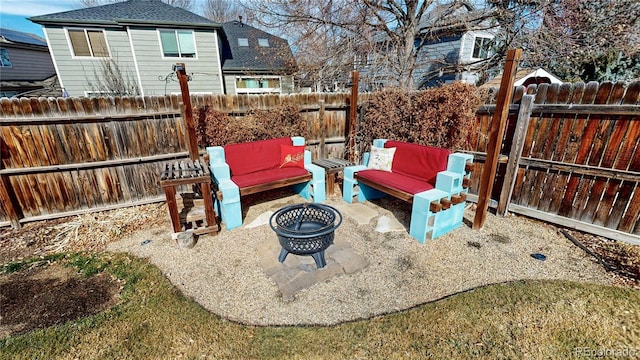 view of patio featuring an outdoor living space with a fire pit and a fenced backyard