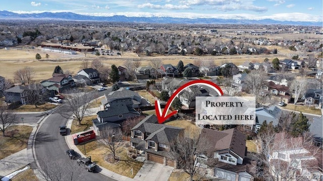 birds eye view of property featuring a residential view and a mountain view