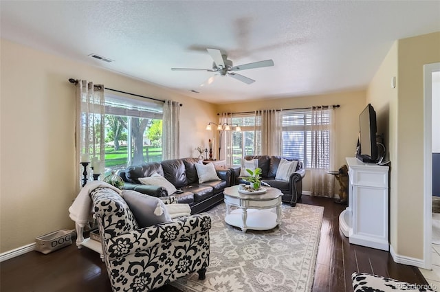 1201 Trout Creek Cir, Longmont, CO 80504 - living room featuring dark wood-type flooring, a ceiling fan, and a textured ceiling