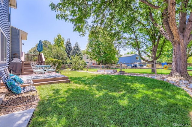 1201 Trout Creek Cir, Longmont, CO 80504 - view of yard with a wooden deck