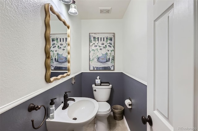 1201 Trout Creek Cir, Longmont, CO 80504 - half bath with toilet and tile patterned flooring