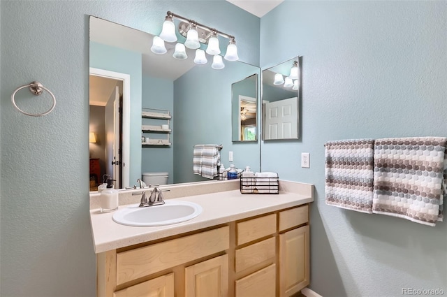 1201 Trout Creek Cir, Longmont, CO 80504 - bathroom featuring vanity and a textured wall