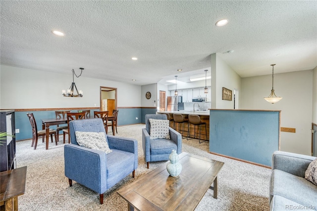 140 Forest Dr, Frisco, CO 80443 - living area featuring light carpet, a textured ceiling, and recessed lighting