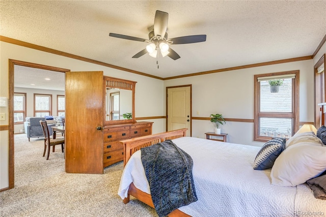 140 Forest Dr, Frisco, CO 80443 - bedroom featuring multiple windows, light colored carpet, a textured ceiling, and ceiling fan