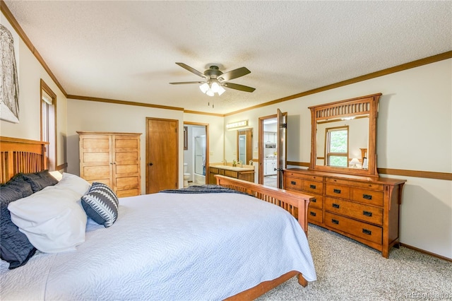 140 Forest Dr, Frisco, CO 80443 - bedroom featuring light carpet, ornamental molding, a textured ceiling, connected bathroom, and a ceiling fan