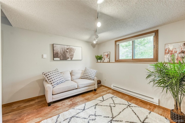 140 Forest Dr, Frisco, CO 80443 - sitting room with baseboard heating, a textured ceiling, track lighting, wood finished floors, and baseboards