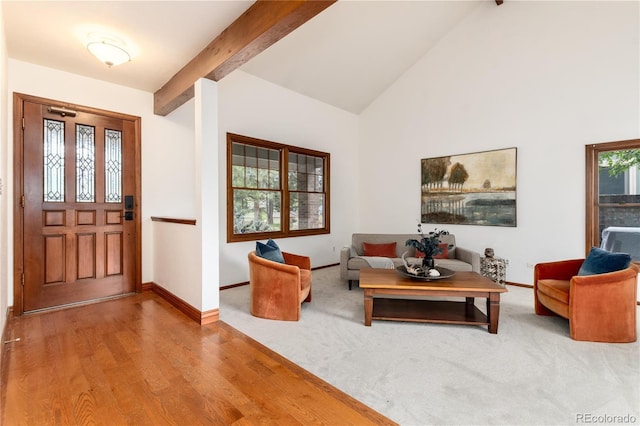 entrance foyer with beamed ceiling, baseboards, wood finished floors, and high vaulted ceiling