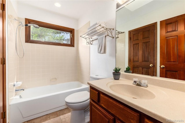 full bath with toilet, tile patterned flooring, vanity, and shower / bathtub combination
