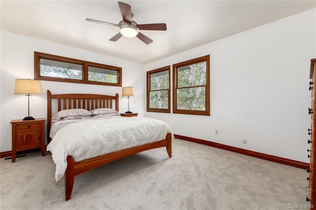 bedroom with carpet floors, baseboards, and ceiling fan