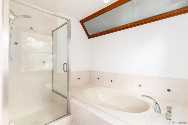 full bath featuring a shower stall and a garden tub