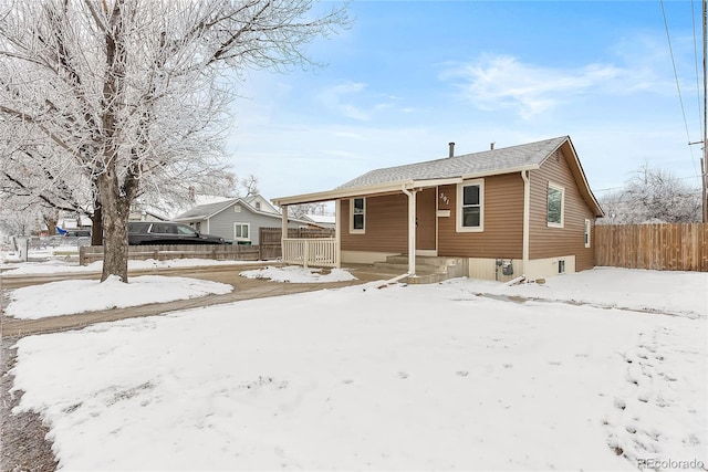 view of front of home featuring fence